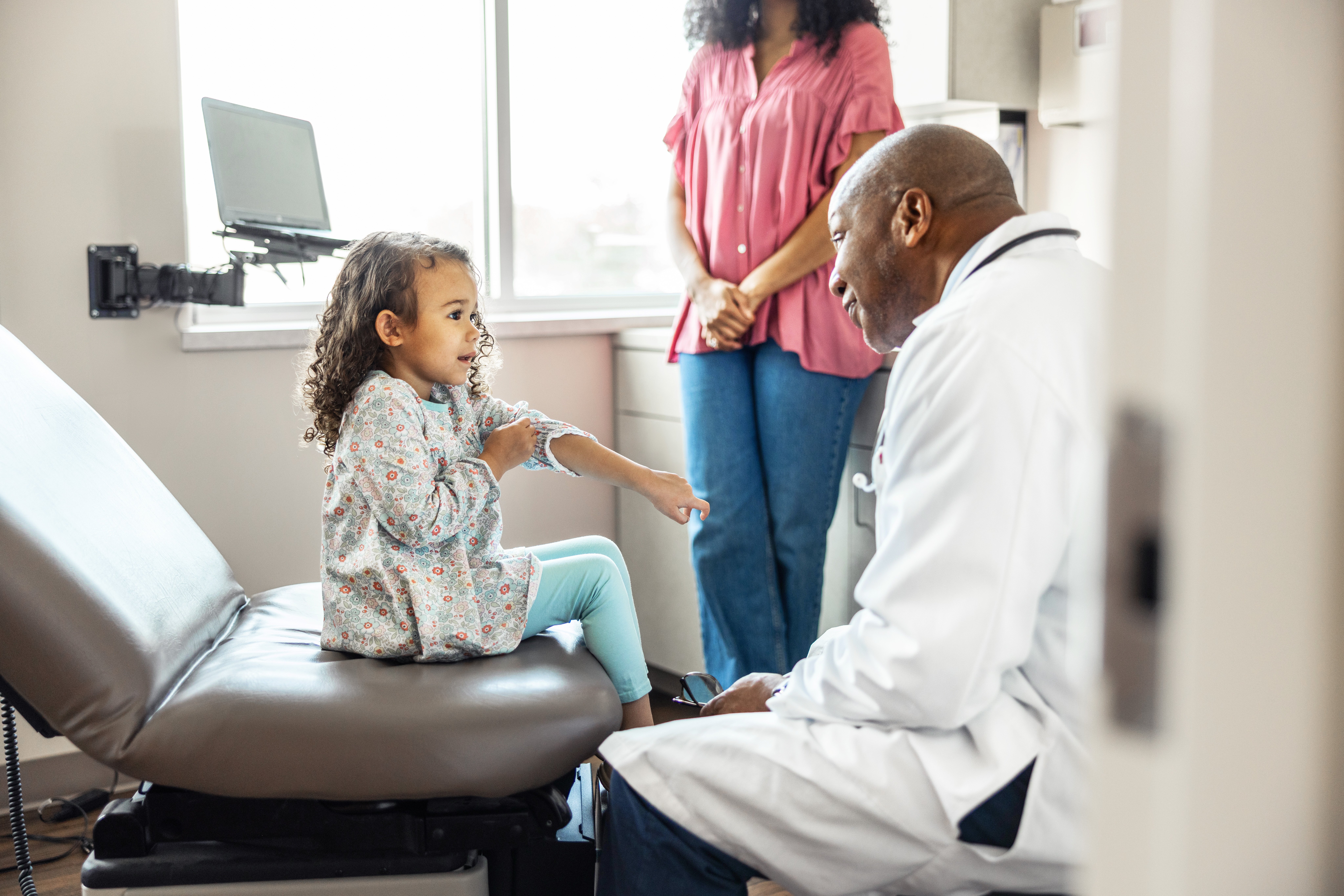 Clinician interacting with patient in the clinic